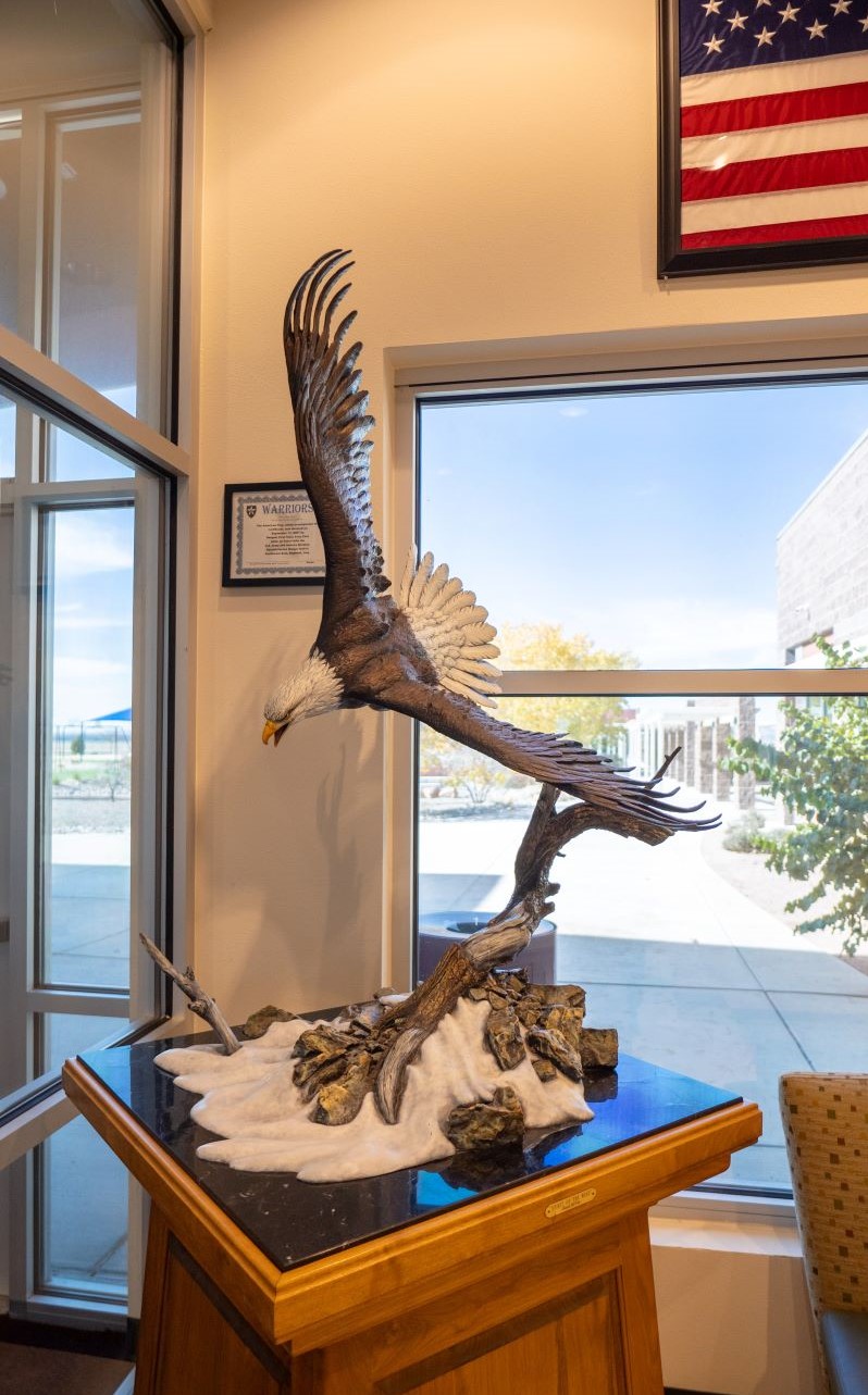Flying eagle sculpture in school lobby