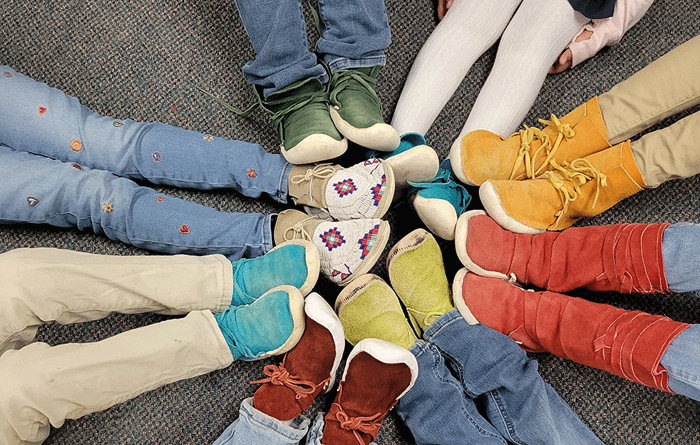 Shoes of students displayed in a circle.